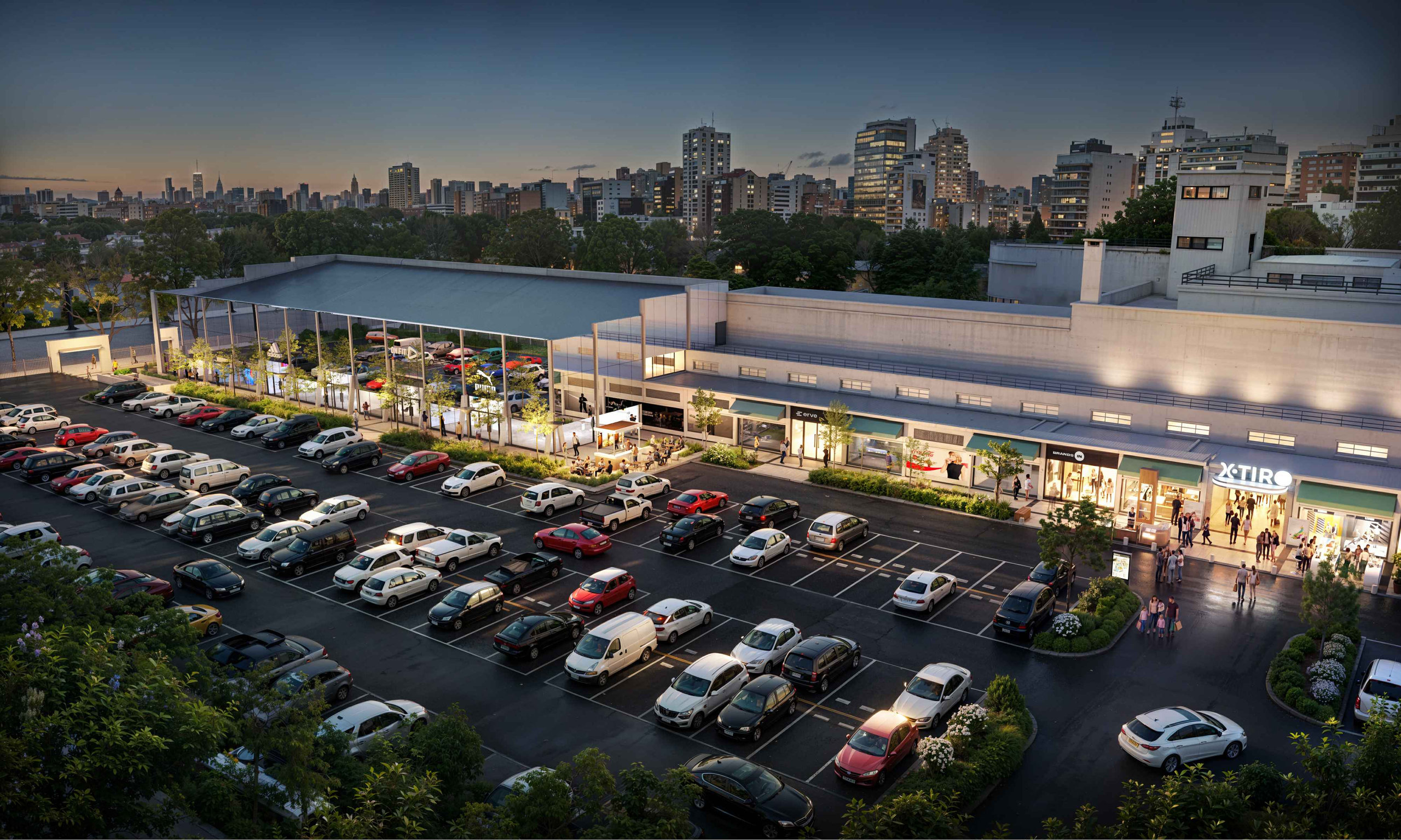 Render aéreo al atardecer: la galería de locales de XTiro frente a la playa de estacionamiento, con la ciudad de fondo.